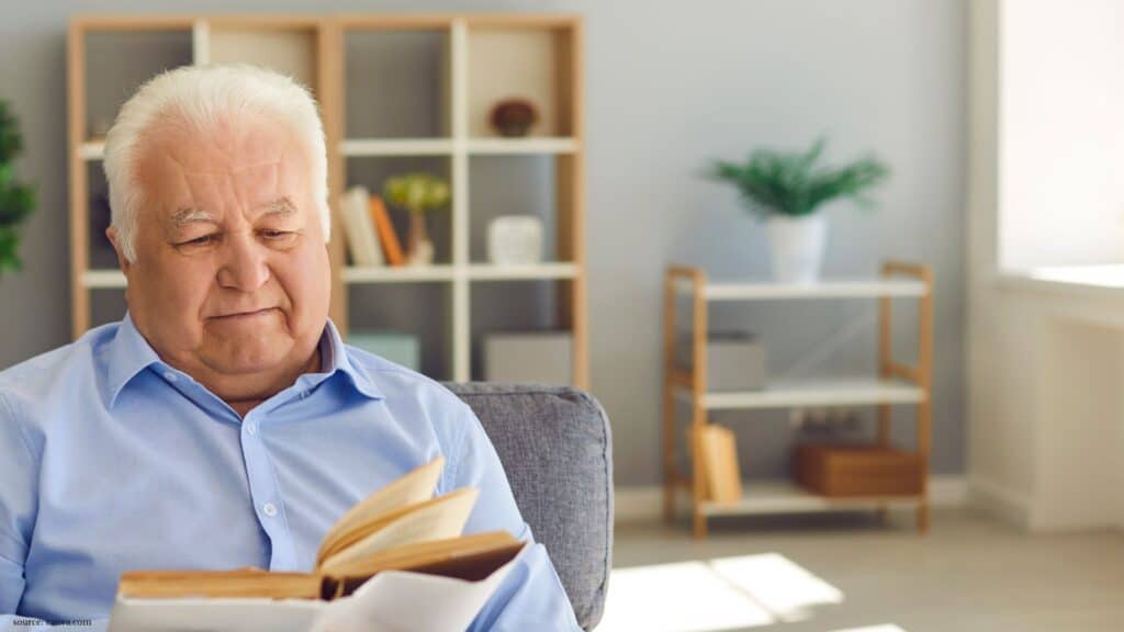 old man reading book